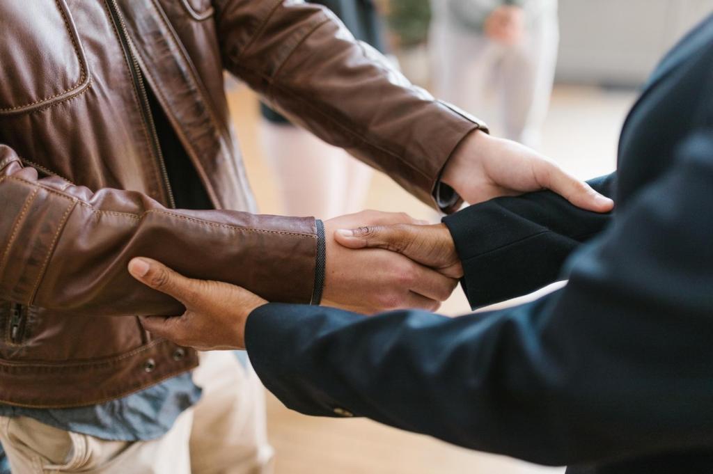 Two people shake hands after a professional encounter.