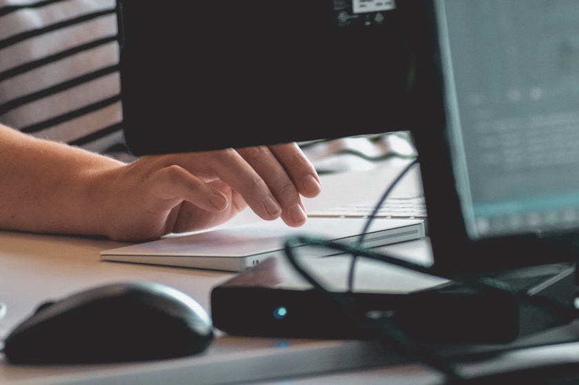 A worker sits at a desk.